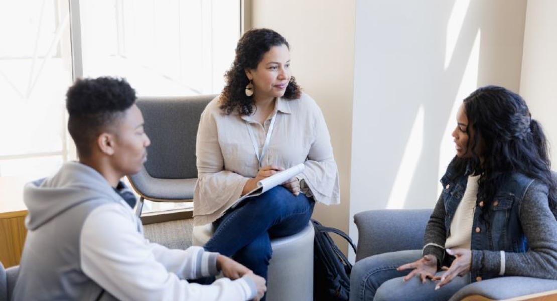 three adults talking