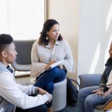 three adults talking